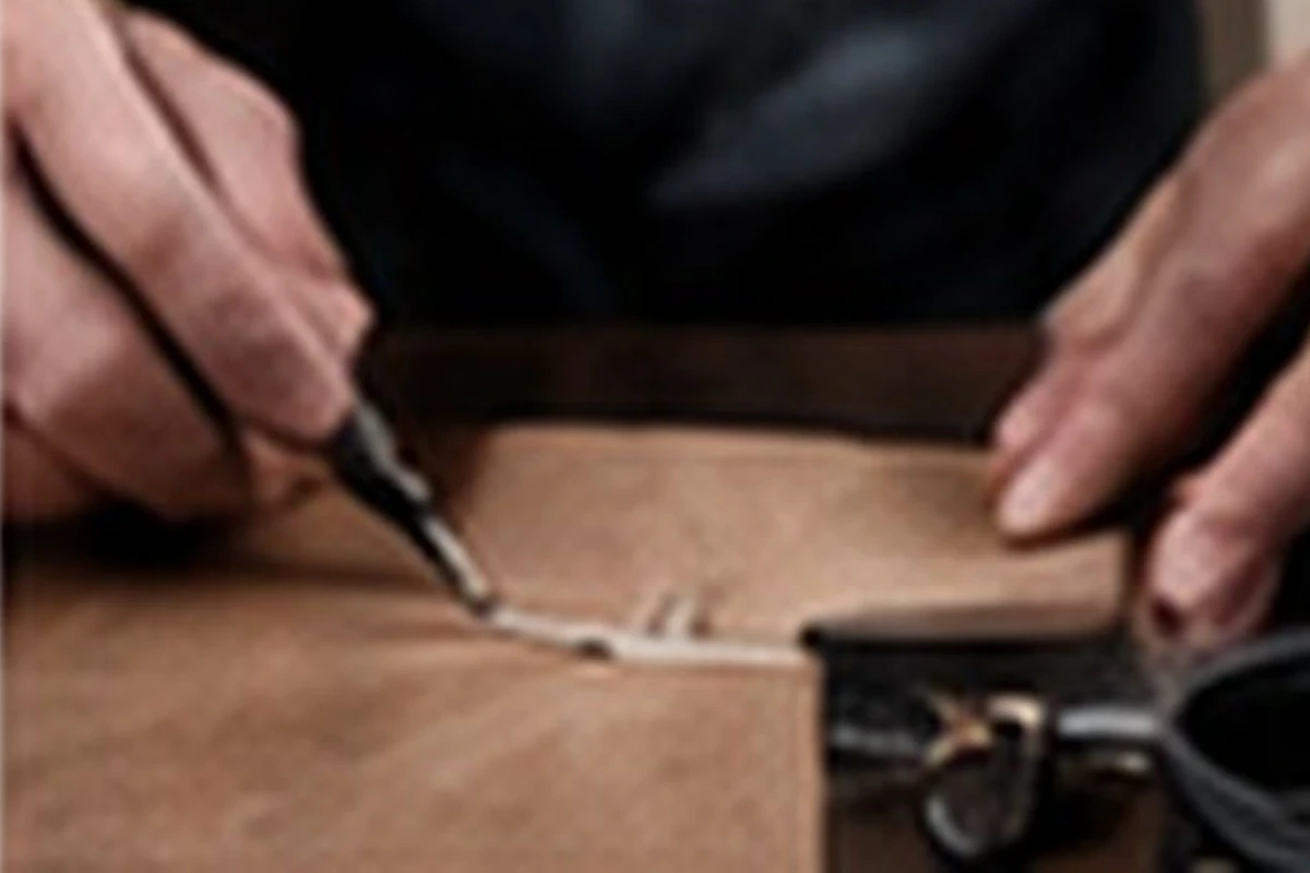 Leather being measured and cut by hand